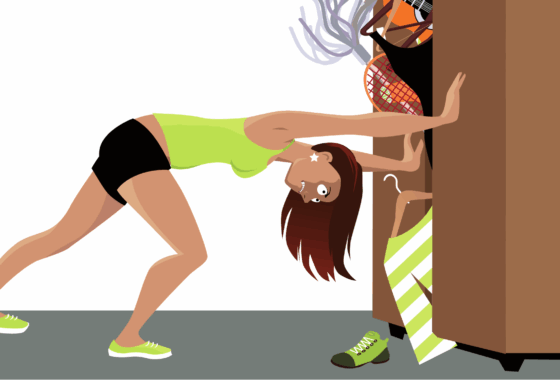 Woman pushing cluttered closet door